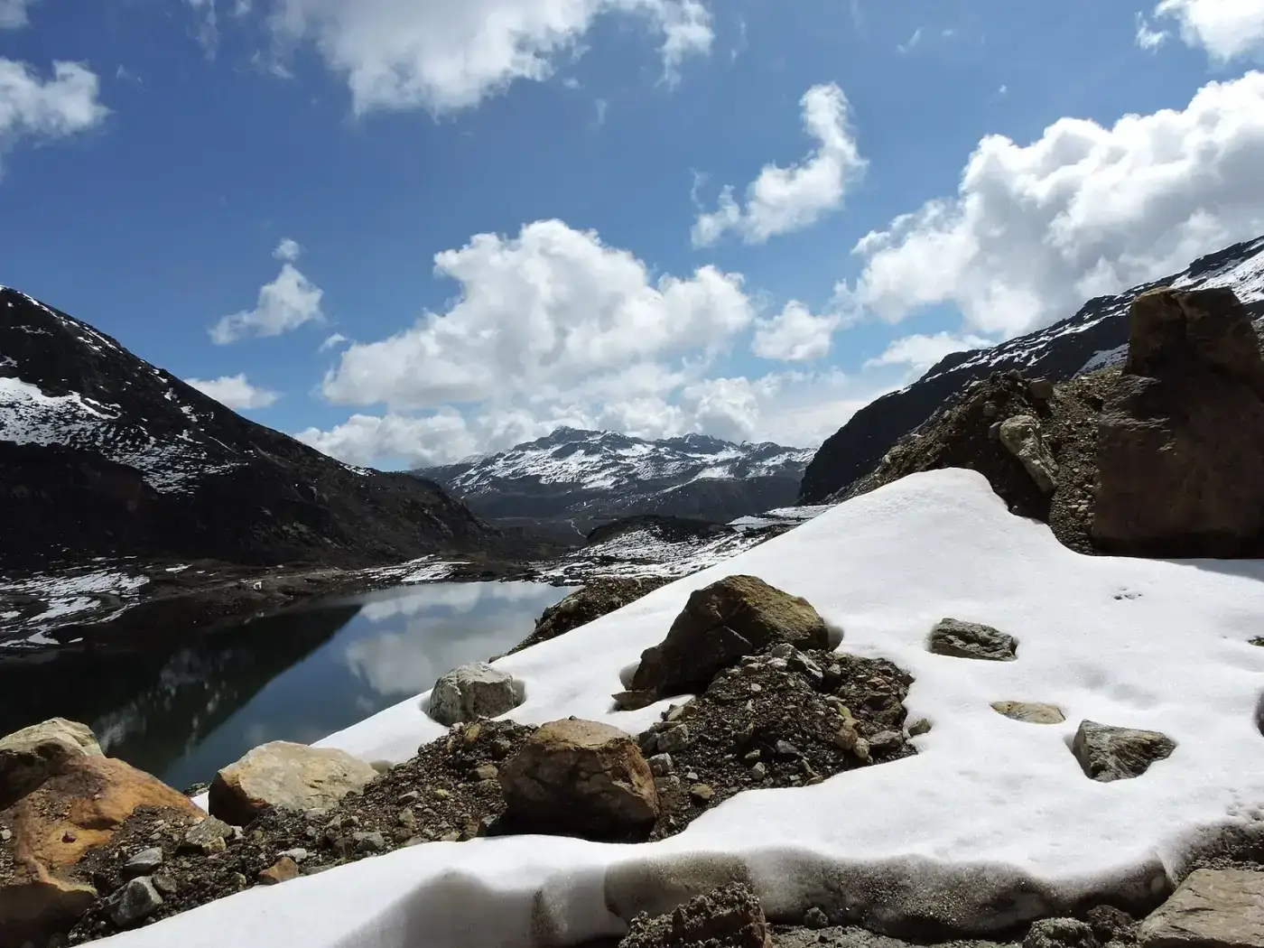 Snow and frozen lake on the road to Bum La Pass