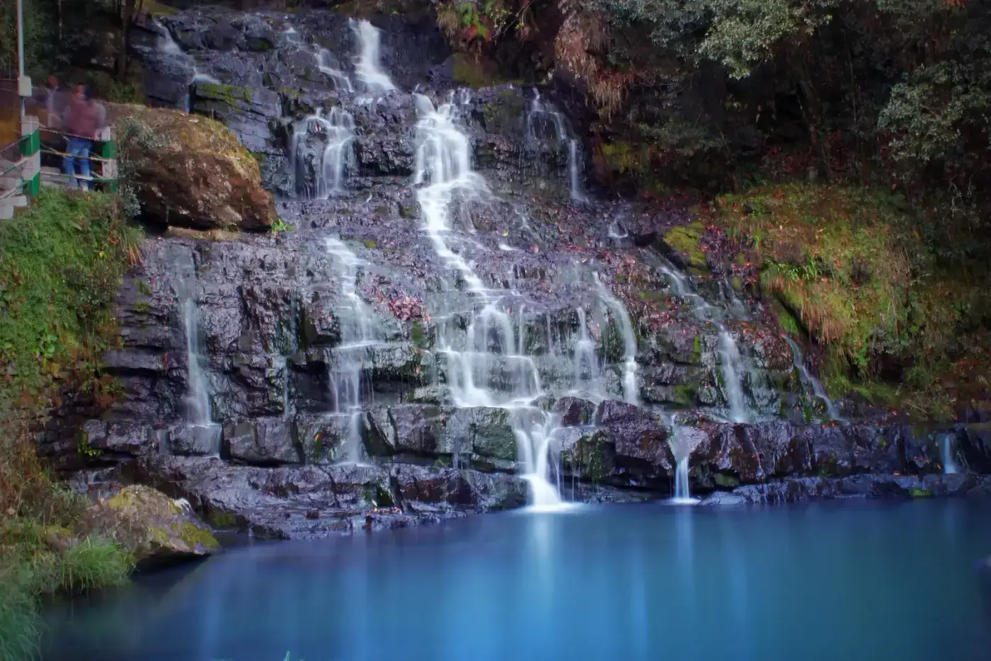 Elephant Falls cascading into a blue pool near Shillong
