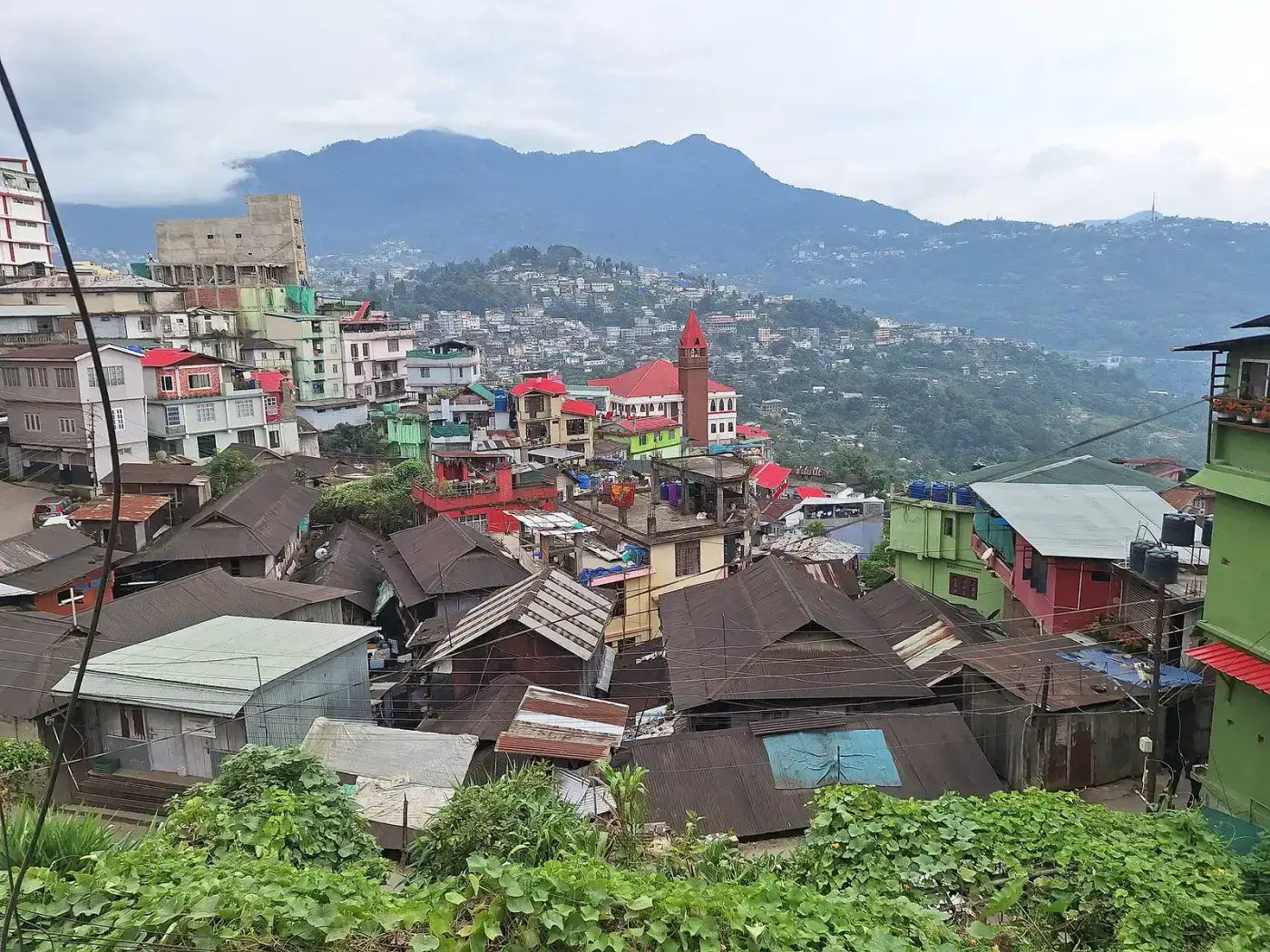 Kohima rooftops with mountains in the distance