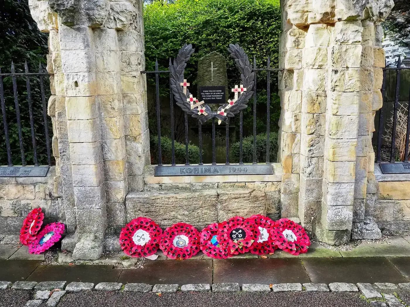 Poppy wreaths at a memorial in the Kohima War Cemetery