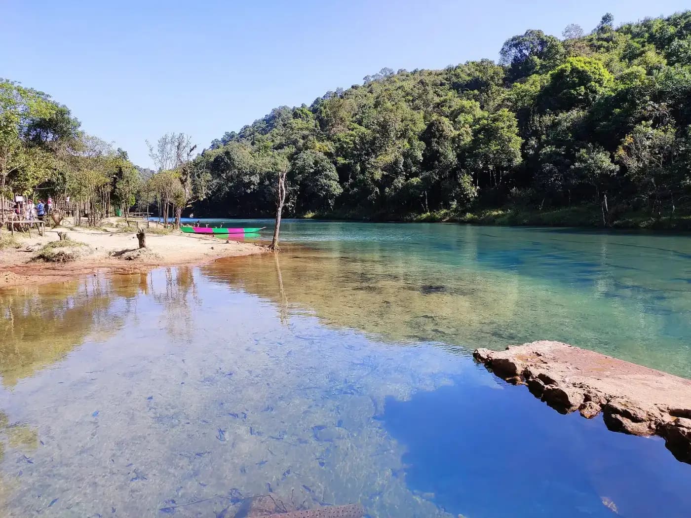 Clear blue pools below Krang Suri Falls