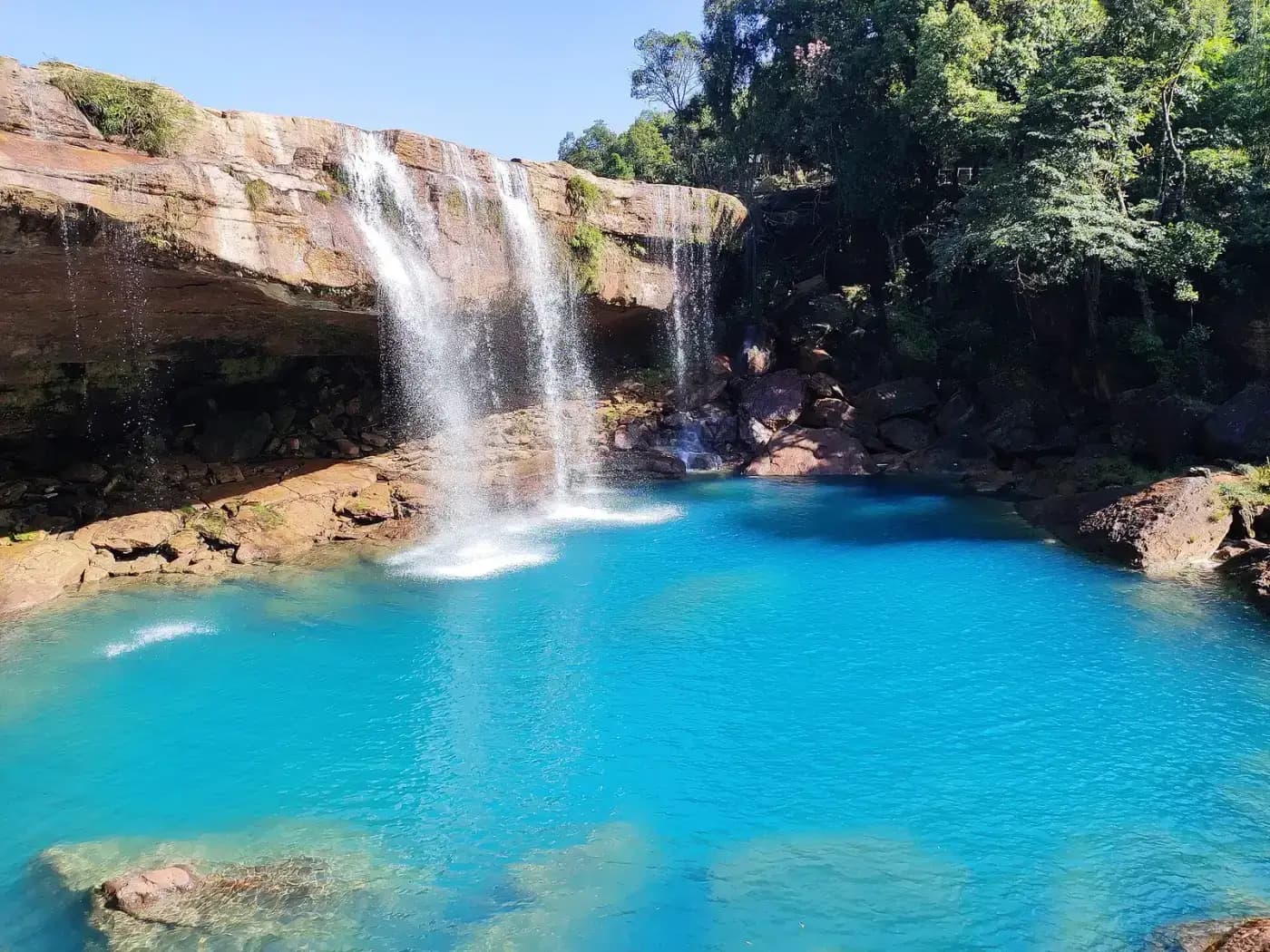 Krang Suri Falls pouring into a turquoise pool, West Jaintia Hills