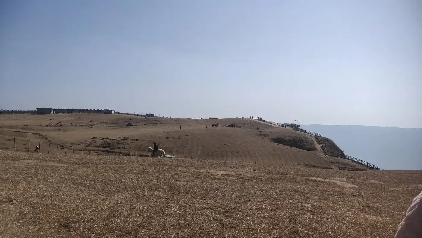 Grassy rim of the Laitlum viewpoint above the gorges