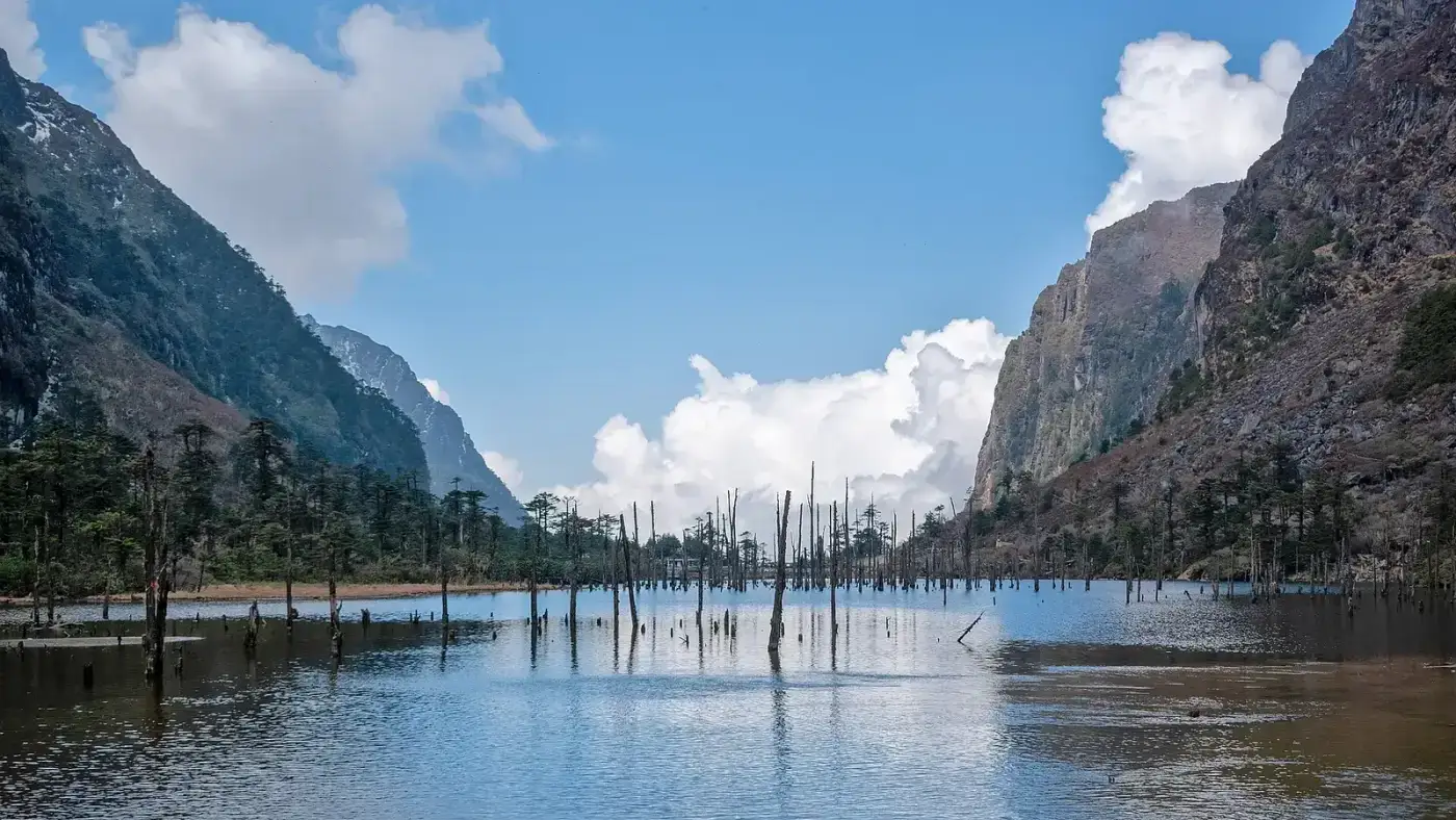 Madhuri Lake beneath rocky cliffs, Tawang district