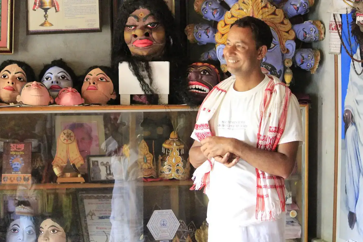 Traditional Bhaona masks displayed by an artisan at a satra in Majuli