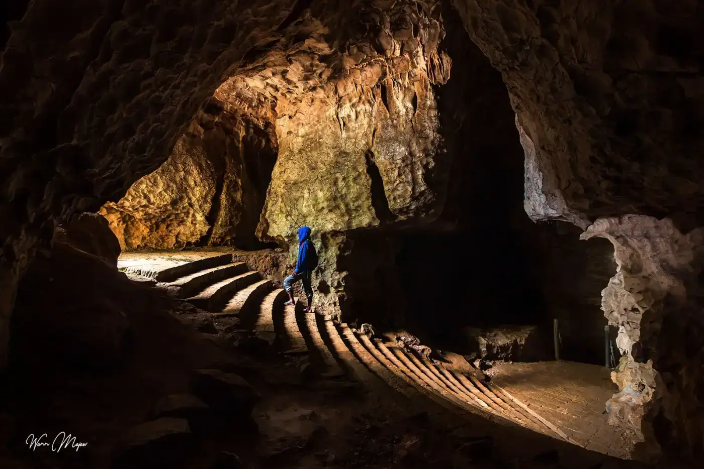 Explorer in a large cave passage in Meghalaya