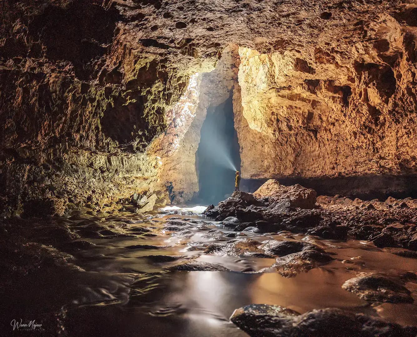 Underground waterfall inside a Meghalaya limestone cave