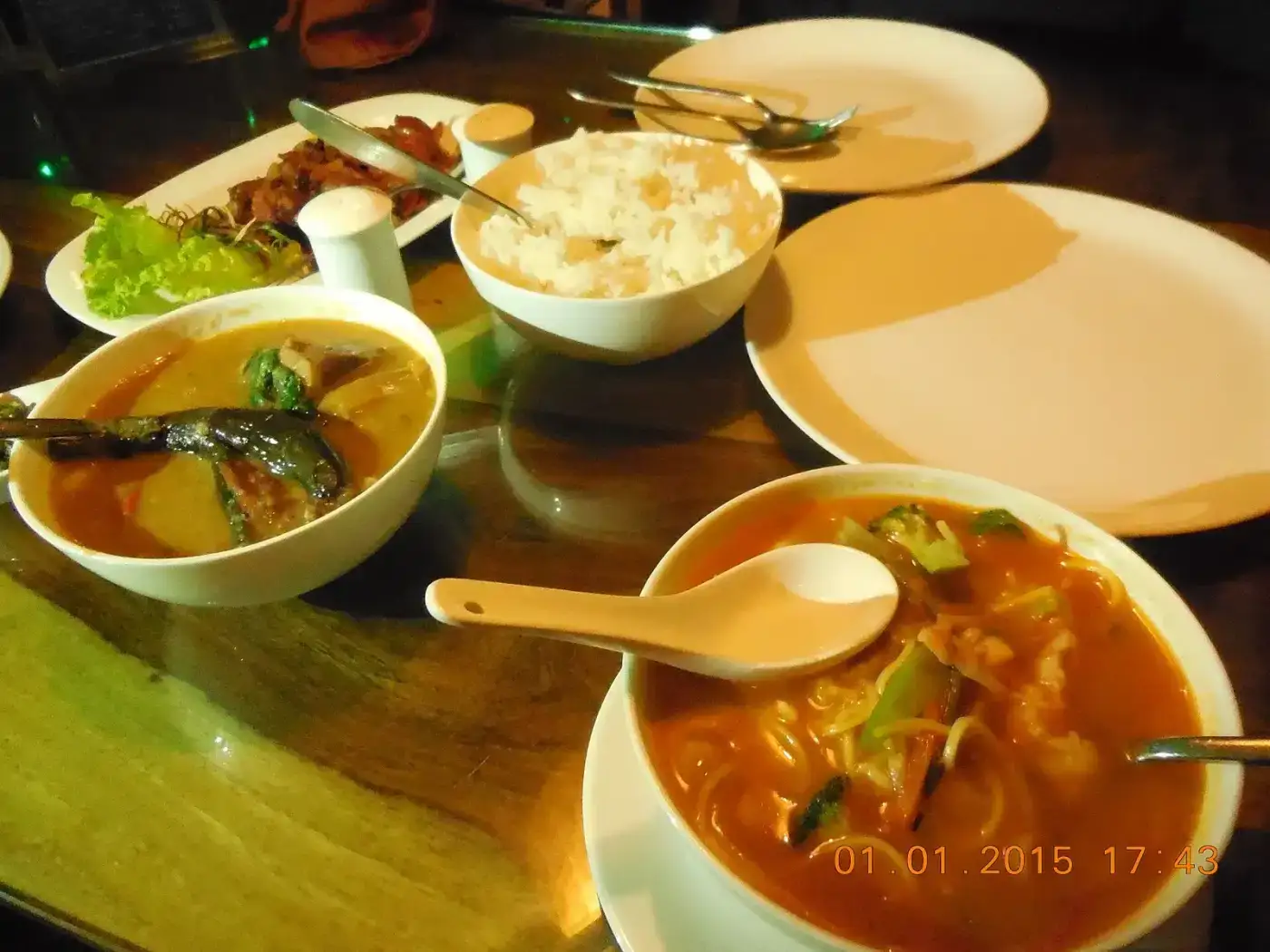 Naga meal of smoked meat, greens and chutneys