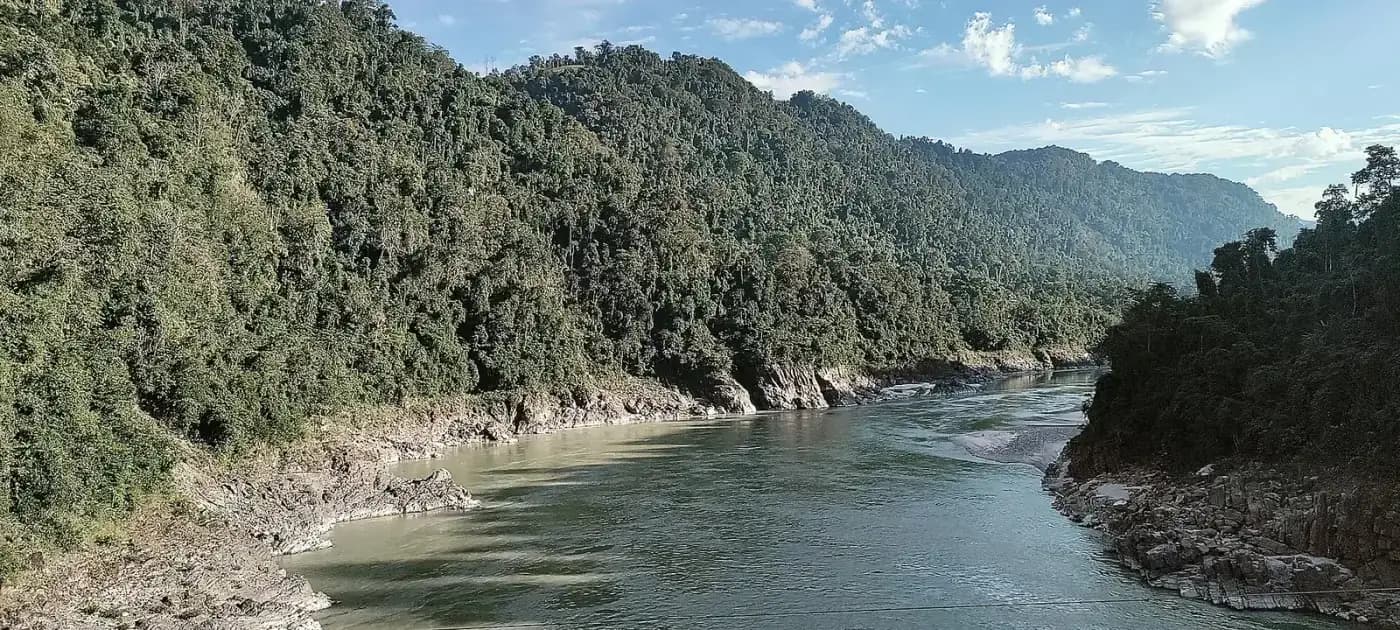 The Siang river flowing through a forested gorge in Arunachal Pradesh