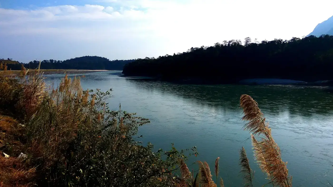 Wide Siang river with forested hills