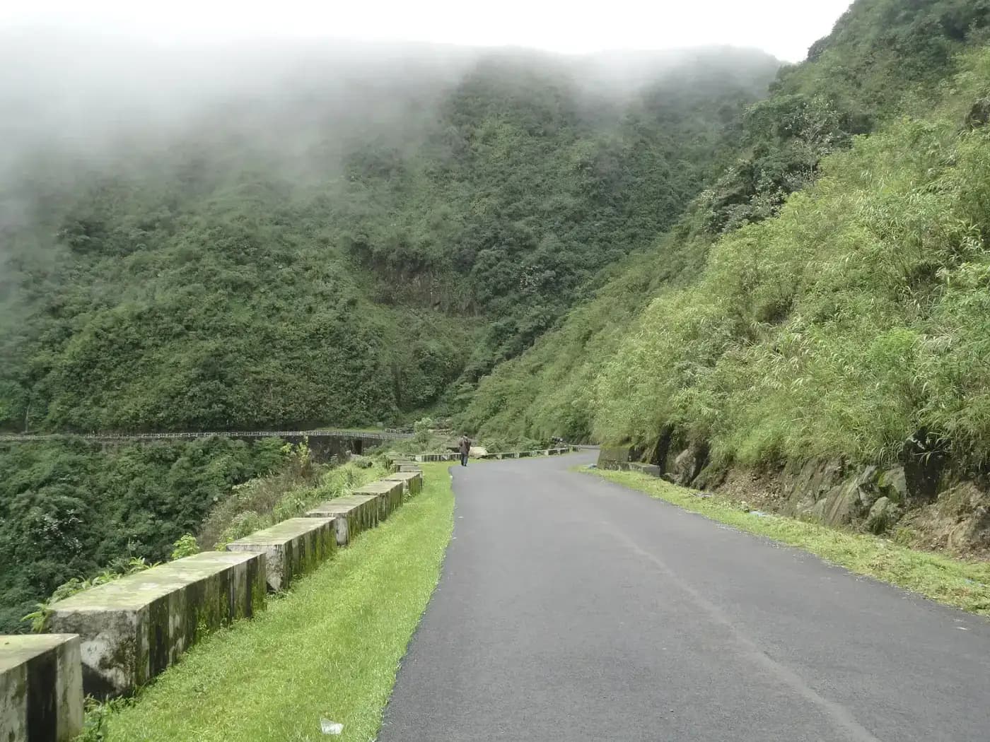 Misty mountain road through the hills of Sohra