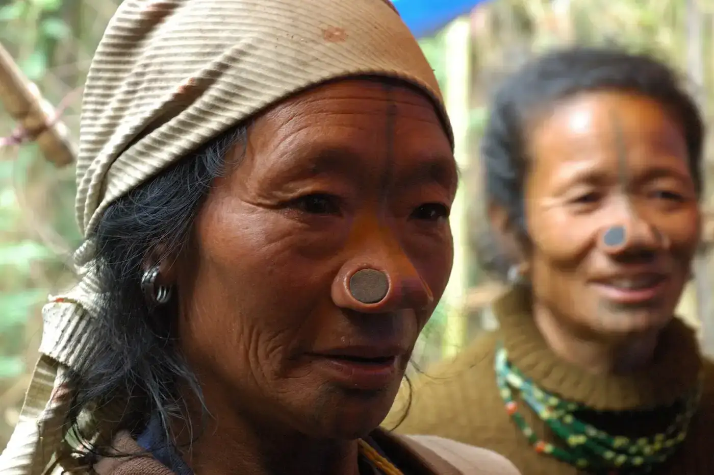 Apatani elders with traditional nose plugs and tattoos in Ziro