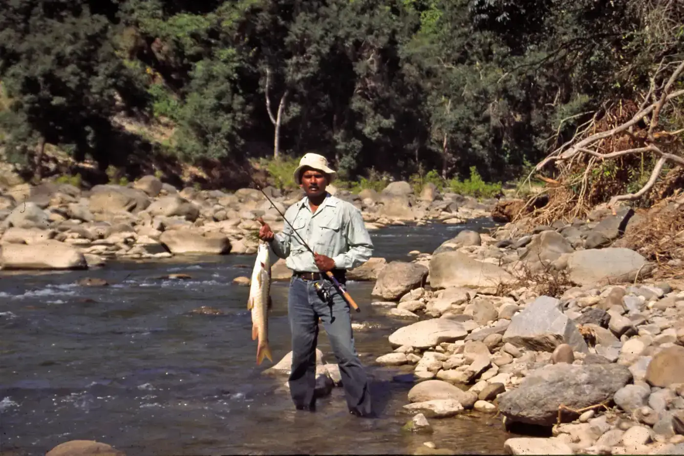Angler fishing in a mountain river in Northeast India