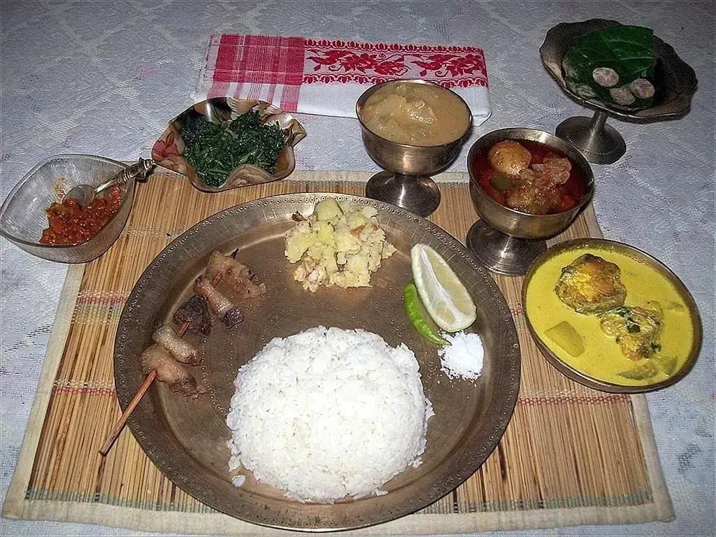 Assamese meal served on a bamboo tray