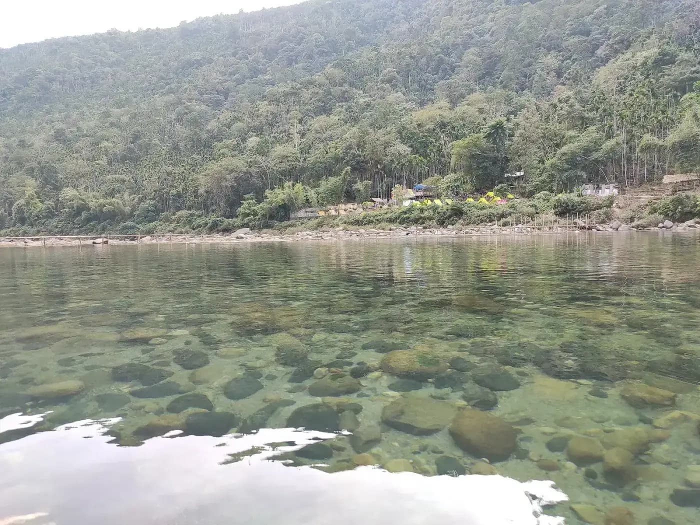 Crystal-clear water of the Umngot river showing the riverbed at Dawki
