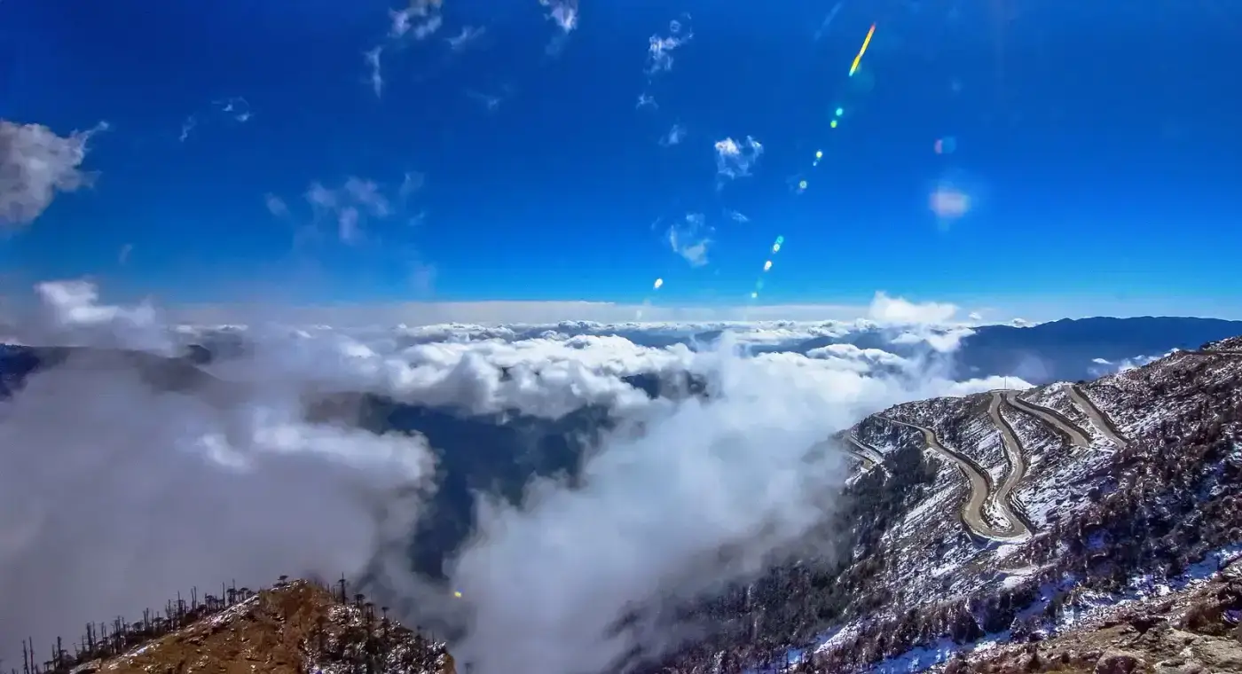 Clouds and snow peaks seen on a high-altitude drive in Arunachal Pradesh