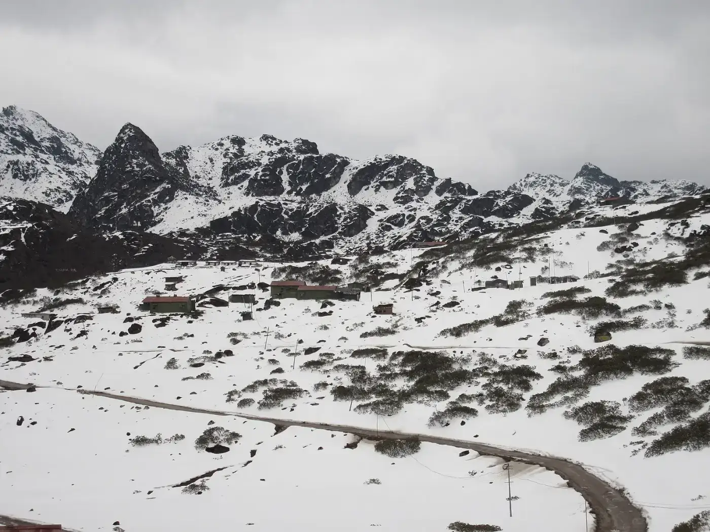 Snowfields beside the high road near Sela Pass