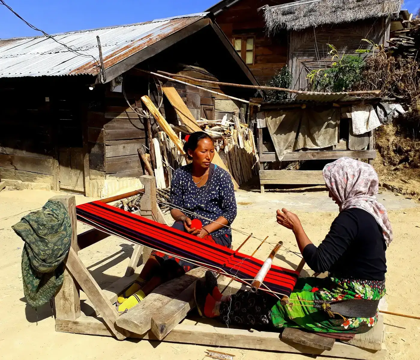 Naga woman weaving on a traditional back-strap loin loom