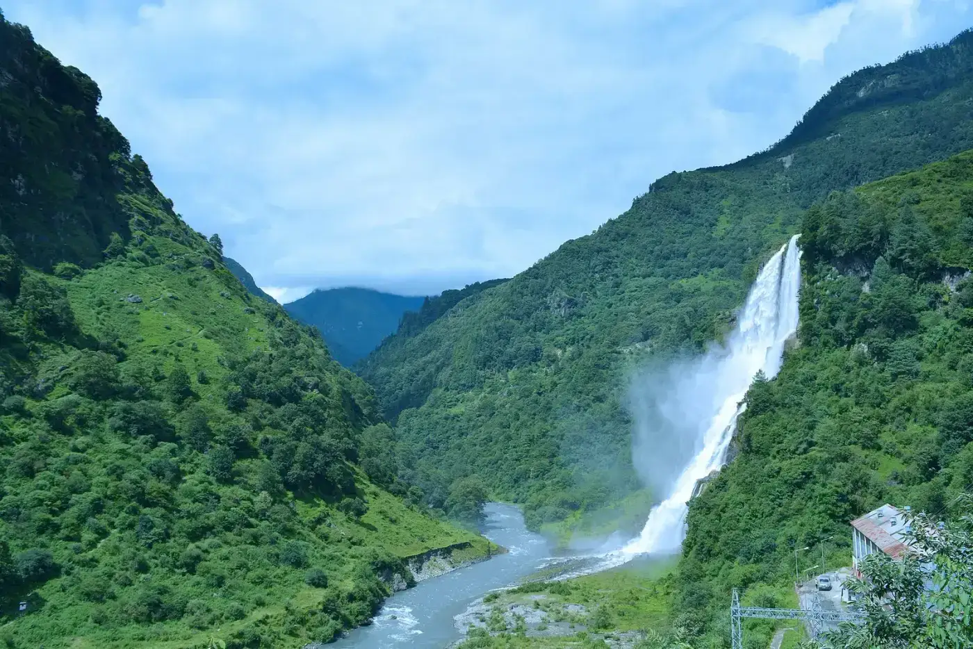 Nuranang (Jang) Falls cascading into a green valley near Tawang