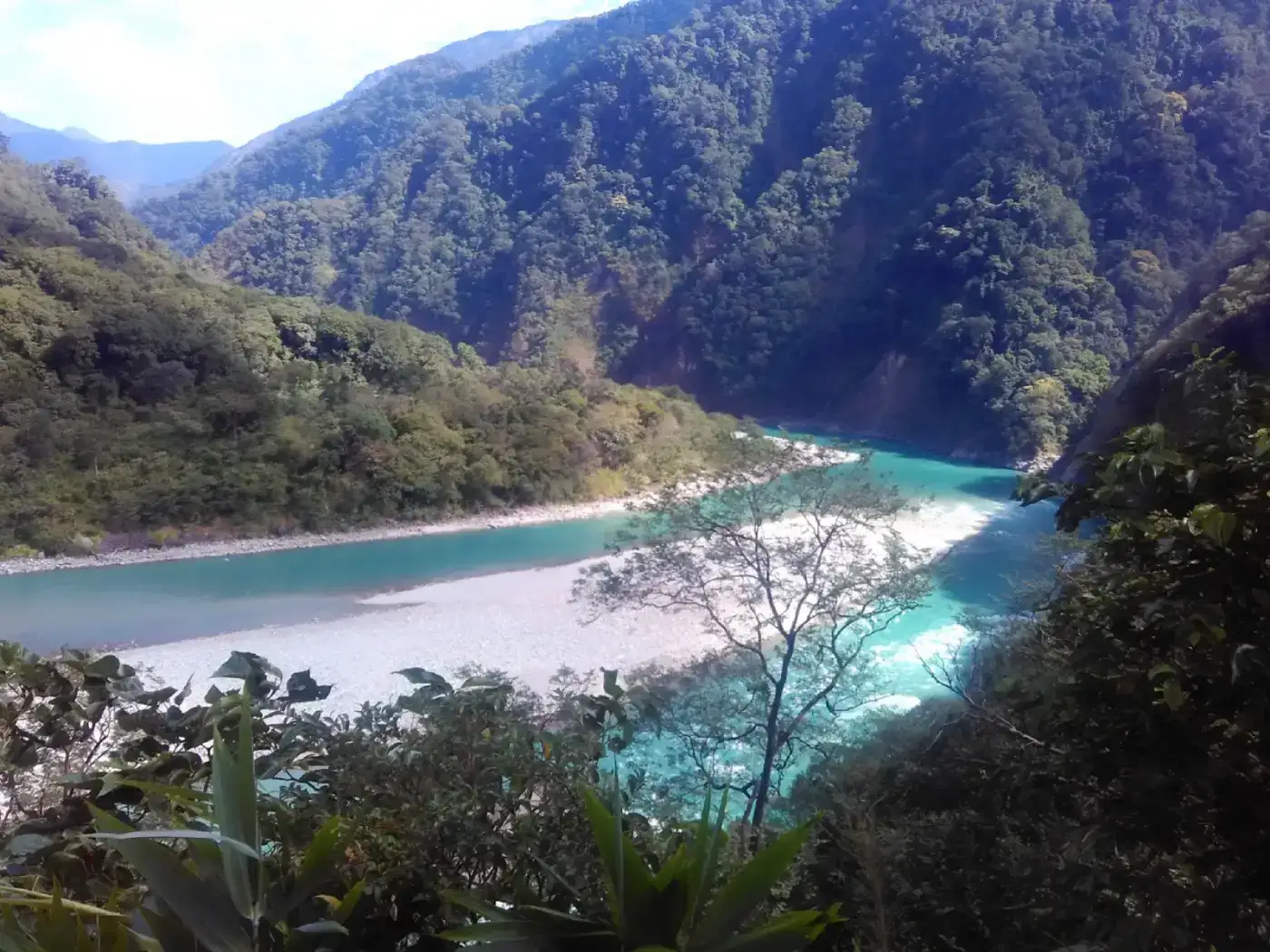 Turquoise Lohit river flowing past Parshuram Kund