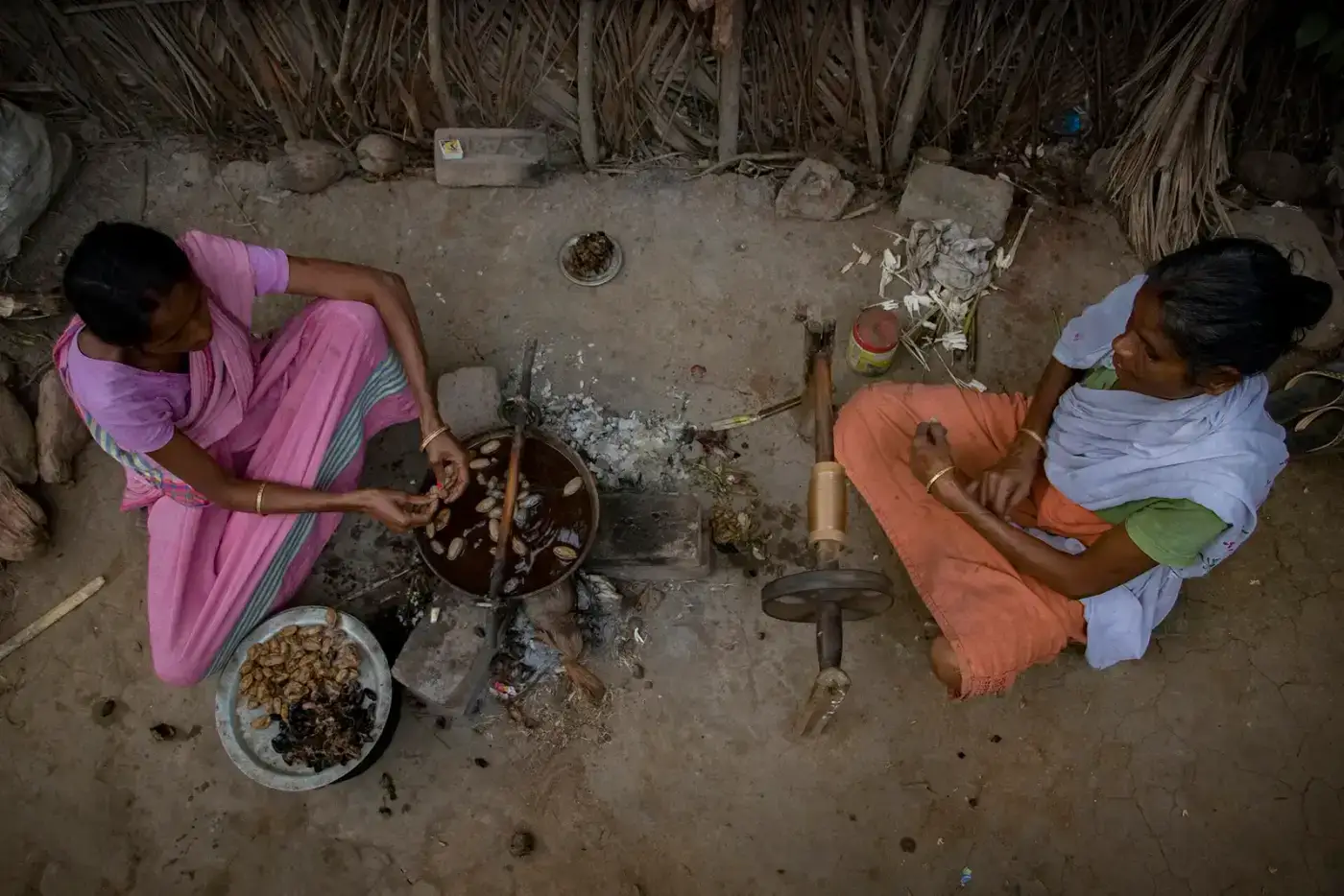Women reeling silk thread in an Assam village