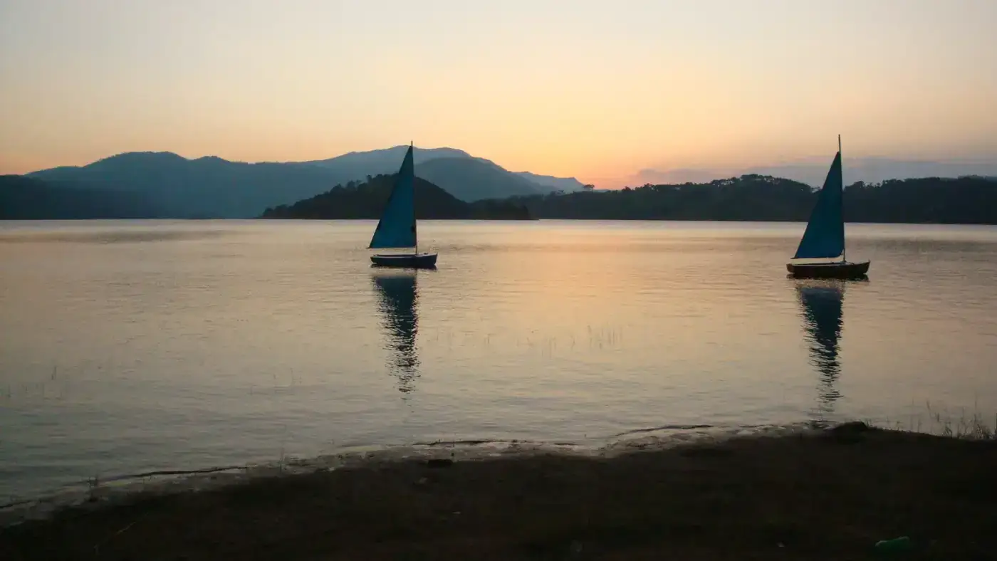 Sailboats on Umiam Lake at sunset